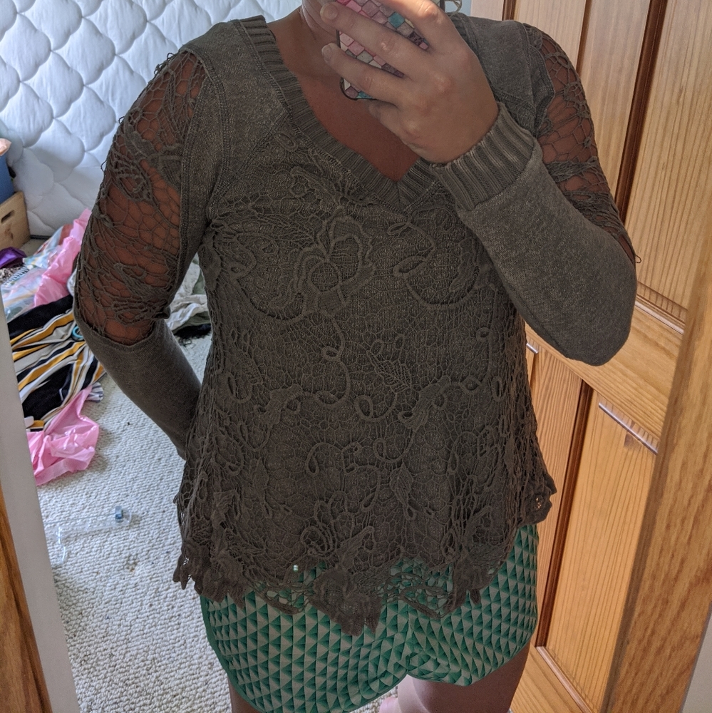 Lace sweater with open back.